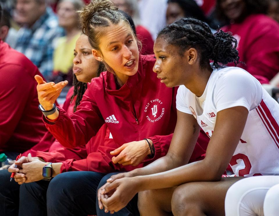 Indiana Assistant Coach Ali Patberg talks with Indiana's Chloe Moore-McNeil (22) during the second half of the Indiana versus Lipscomb women's basketball game at Simon Skjodt Assembly Hall on Sunday, Nov. 19, 2023.