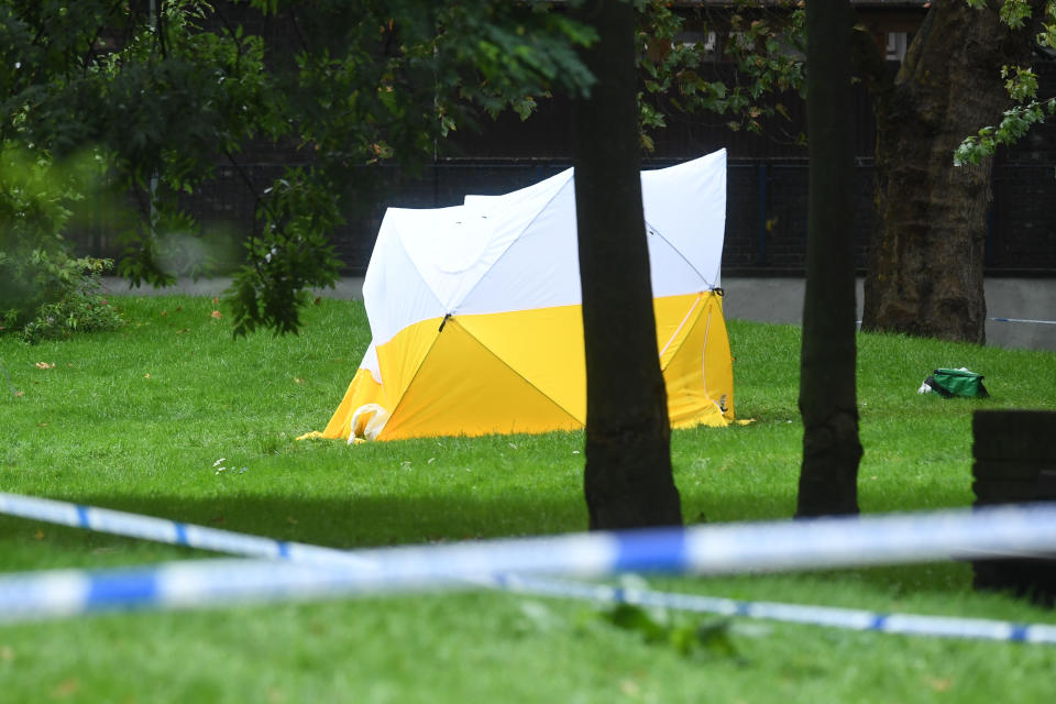 A police tent on Grimsel Path on the Brandon Estate, Camberwell, south London, where an 18-year-old man has died following a stabbing on Thursday evening (PA)