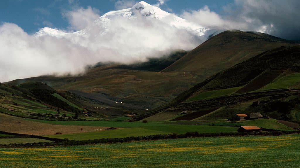 Cayambe volcano shrouded by clouds, Andes