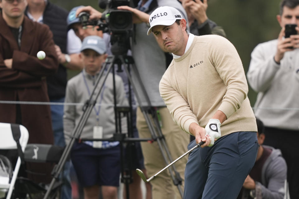 Patrick Cantlay chips on the third green during the third round of the Genesis Invitational golf tournament at Riviera Country Club, Saturday, Feb. 17, 2024, in the Pacific Palisades area of Los Angeles. (AP Photo/Ryan Sun)