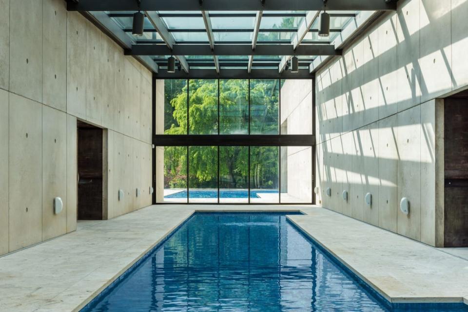 <div class="inline-image__caption"><p>Some people might be satisfied with a gorgeous outdoor pool…but we are not those people. Thanks to Mr. Vinoly, this home offers not only an outdoor spot to swim, but also a heated lap pool indoors. Some call two pools a luxury, we call it a necessity.</p></div> <div class="inline-image__credit">Trulia</div>