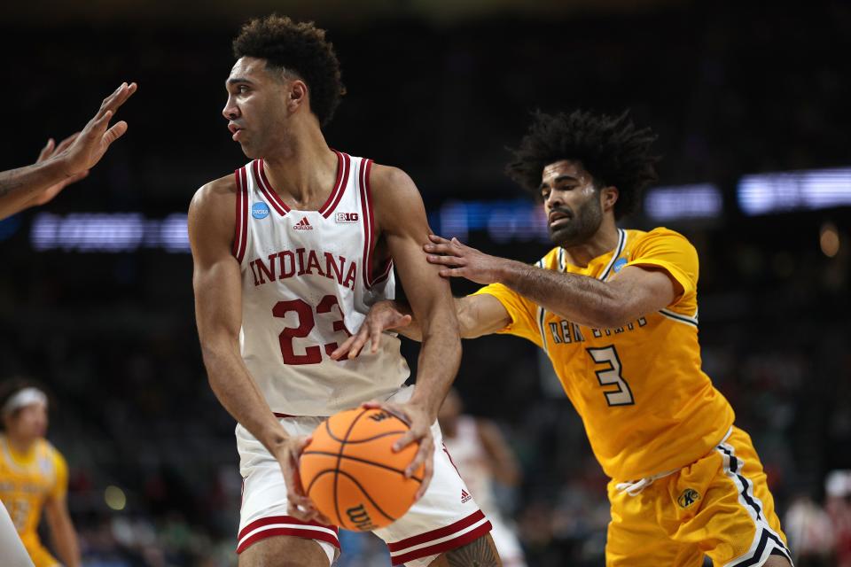 Sincere Carry (3) of  Kent State defends Trayce Jackson-Davis (23) of Indiana in the first half of a first-round NCAA Tournament game at MVP Arena on March 17, 2023 in Albany, New York.