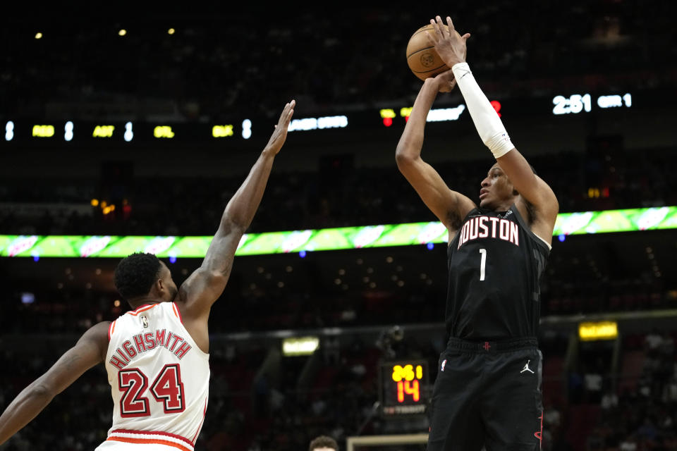 Houston Rockets forward Jabari Smith Jr. (1) shoots a 3-pointer as Miami Heat forward Haywood Highsmith (24) defends during the first half of an NBA basketball game Friday, Feb. 10, 2023, in Miami. (AP Photo/Lynne Sladky)