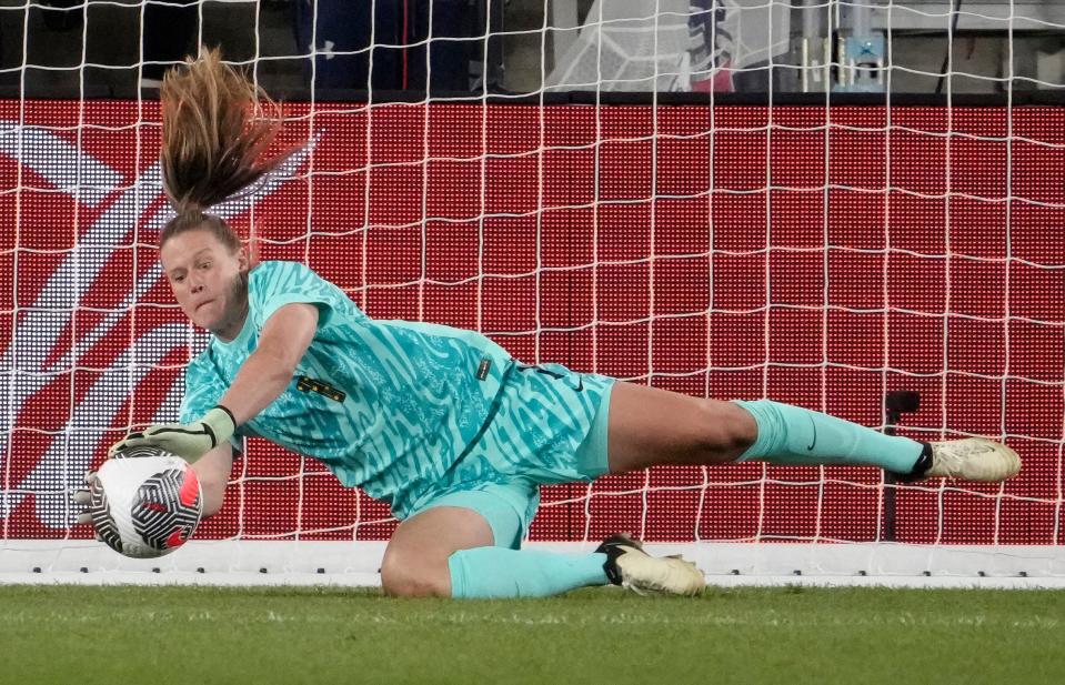 Goalkeeper Alyssa Naeher of the United States saves a penalty kick in the shootout against Canada at the 2024 SheBelieves Cup. The U.S. would win the event, their seventh championship in the tournament.