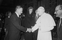 <p>Pope John Paul II, second from right, shakes hands with Zbigniew Brzezinski, former Assistant to the President for National Security Affairs, left, during an audience with the Pontiff granted to the members of the Trilateral Commission, a non-governmental organization of U.S., European and Japanese leaders, Monday, April 18, 1983, Vatican City, Italy. In center is Marella Agnelli, wife of President of FIAT automaker Gianni Agnelli. (Photo: Claudio Luffoli/AP) </p>