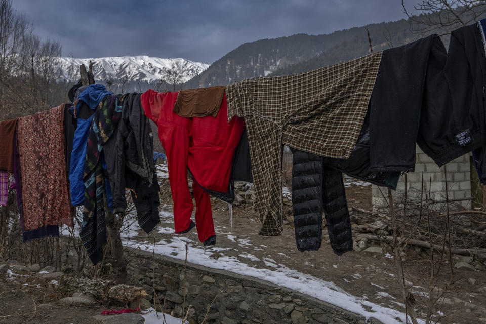 Icicles hang from the clothes left out to dry outside a residential house in Drang village, northwest of Srinagar, Indian controlled Kashmir Friday, Dec. 22, 2023. This is the time of "Chillai Kalan," also called "The Great Winter," a Kashmiri phrase which defines the harshest 40 days of cold in disputed Kashmir that commence in late December and extend into January and early February. Renowned for its breathtaking landscapes, Kashmir in winter transforms into a wonderland. Tourists fill its hotels to ski, sledge and trek the Himalayan landscape.(AP Photo/Dar Yasin)