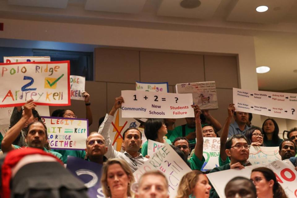 Parents wanting to speak at a CMS school board meeting trickle into the chamber on Tuesday, April 23, 2023 at the Charlotte Mecklenburg Government Center.