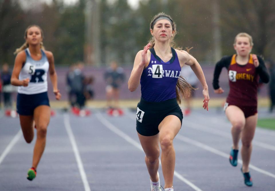 Norwalk's Claire Farrell competes in the 100-meter dash during an April track meet in Waukee.