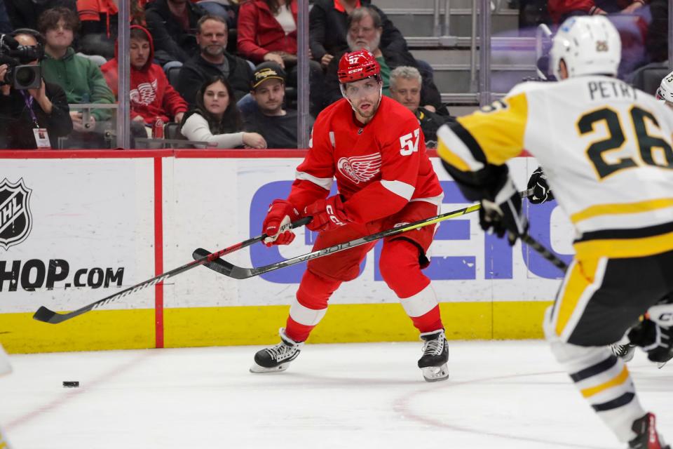 Red Wings left wing David Perron handles the puck during the second period against the Penguins on Tuesday, March 28, 2023, at Little Caesars Arena.