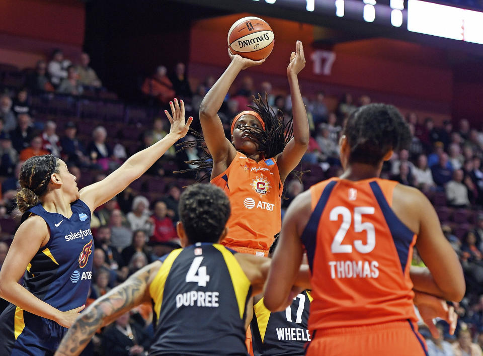 FILE - In this May 28, 2019, file photo, Connecticut Sun center Jonquel Jones shoots over the Indiana Fever defense during a WNBA basketball game, in Uncasville, Conn. Led by Jones, the Sun (8-1) have won their last six games and have started to put a little distance between themselves and the rest of the league. (Sean D. Elliot/The Day via AP, File)