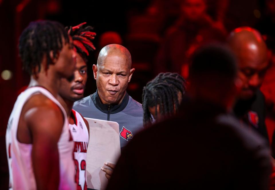 Louisville's Kenny Payne concentrates as the Card introductions are announced before the game against Pitt at the KFC Center Wednesday night. Jan. 18, 2023 