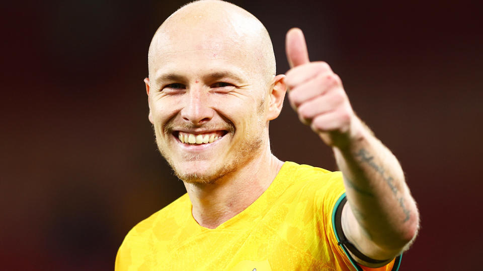 Aaron Mooy gives a thumbs up during a Socceroos game.