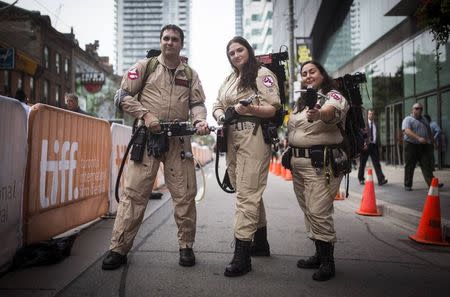 (L-R) Michael Tigani, Seulenge Houle, and Adriana Munoz pose during "Bill Murray Day", to commemorate actor Bill Murray, at the Toronto International Film Festival, September 5, 2014. REUTERS/Mark Blinch