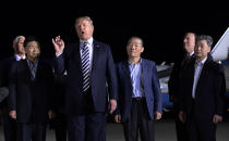 <p>President Donald Trump speaks as he stands with Tony Kim, second left, Kim Dong Chul, center right, and Kim Hak Song, right, three Americans detained in North Korea for more than a year, after they arrived at Andrews Air Force Base in Md., Thursday, May 10, 2018. Vice President Mike Pence, left, and Secretary of State Mike Pompeo, second from right, listen. (Photo: Susan Walsh/AP) </p>