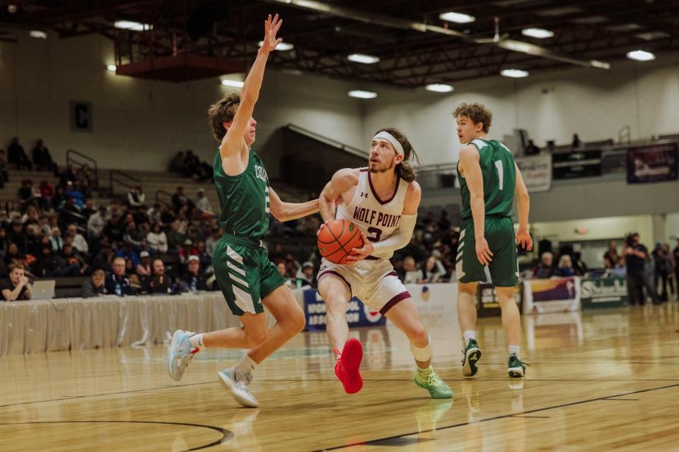 Wolf Point's Julian Benson eyes the basket in the Wolves' first-round contest against Columbus in the Class B state basketball tournament Thursday at Four Seasons Arena.