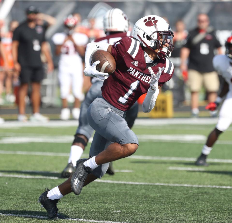 River Rouge receiver Jaylen Watson runs against Cedar Springs during first-half action of the Xenith Prep Kickoff Classic at  Tom Adams Field at Wayne State on Saturday, Aug. 27, 2022.