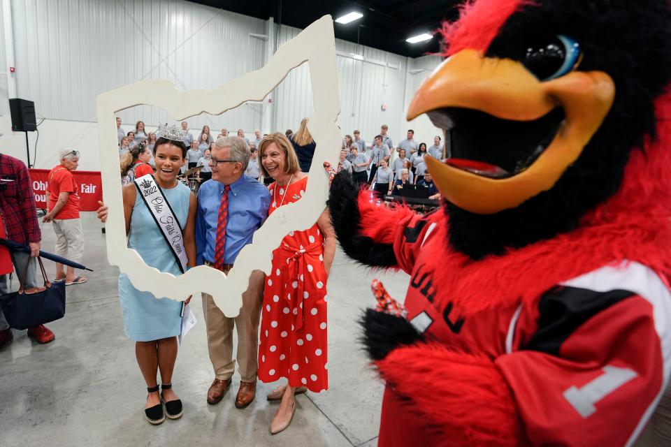 Gov. Mike DeWine and his wife, Fran, meet Ohio Fair Queen Maya Kidd of Butler County during the opening day of the Ohio State Fair.