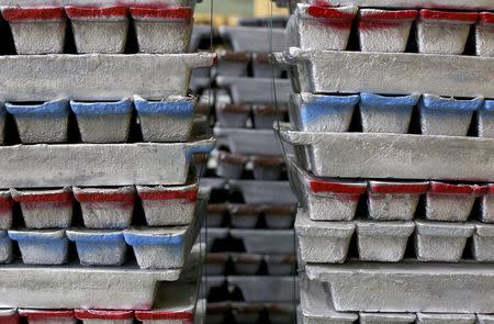 Stacks of leads bars, used for preparing FIAMM batteries, are seen as they are charged in this photo illustration taken at the battery maker's factory in Avezzano, near L'Aquila, November 28, 2014. REUTERS/Alessandro Bianchi