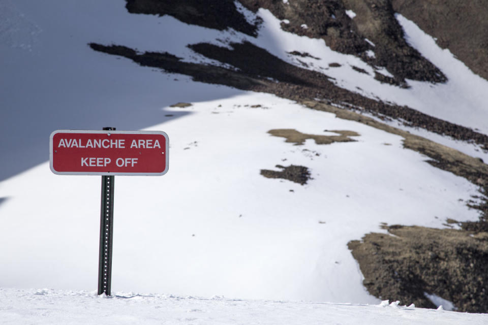 A red sign—the simplest form of avalanche warning.<p>Ryan McGinnis/Getty Images</p>