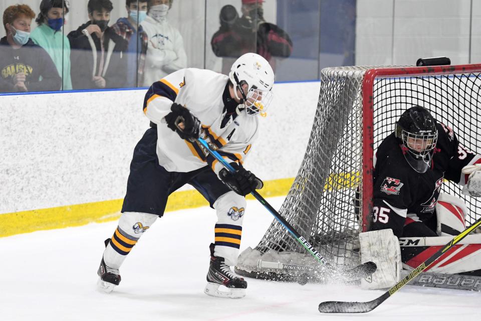 Northern Highlands hockey vs. Ramsey in the Ice Vault Tournament championship game on Friday, March 5, 2021. R #7 Justin Bello takes a shot as NH goalie #35 Daniel Moor looks to make the save. 