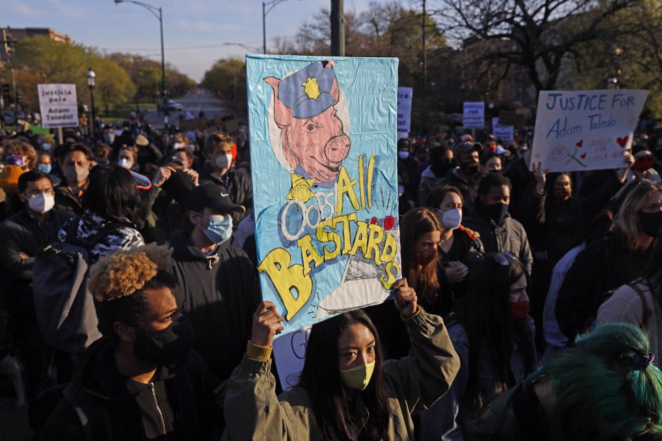 Demonstrators protest the shooting of 13-year-old Adam Toledo, Friday, April 16, 2021, Friday, April 16, 2021, in Logan Park in Chicago. Toledo was shot to death by an officer on March 29 in an alley west of the 2300 block of South Sawyer Avenue in Little Village on the Southwest Side. (AP Photo/Shafkat Anowar)