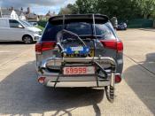 A Mitsubishi Outlander plug-in hybrid is pictured while undergoing tests by Emissions Analytics for a study on emissions by NGO Transport & Environment