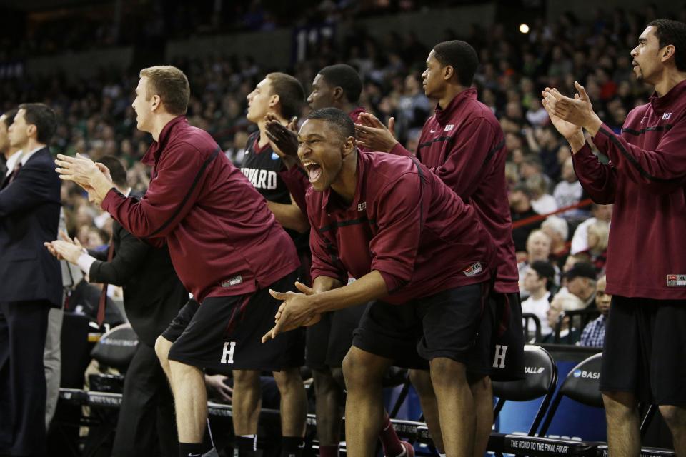 Harvard’s bench celebrates in the second half during the third-round game of the NCAA men's college basketball tournament against Michigan State, in Spokane, Wash., Saturday, March 22, 2014. (AP Photo/Young Kwak)