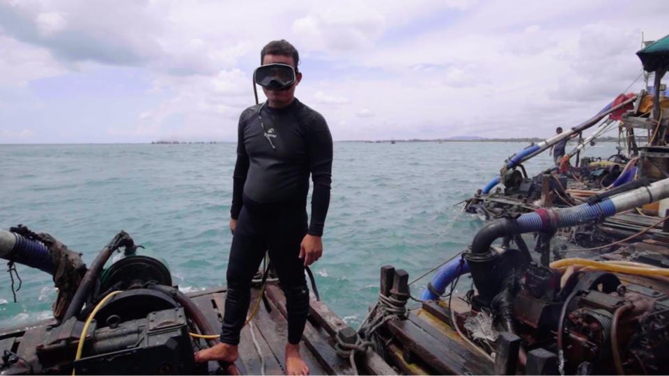 Joko Tingkir in his diving gear onboard his mining pontoon