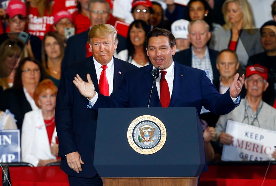 Former President Donald Trump stands behind Ron DeSantis, then a candidate for governor of Florida, at a 2018 rally in Pensacola, Fla. The former allies could find themselves competing against each other for the presidency in 2024.