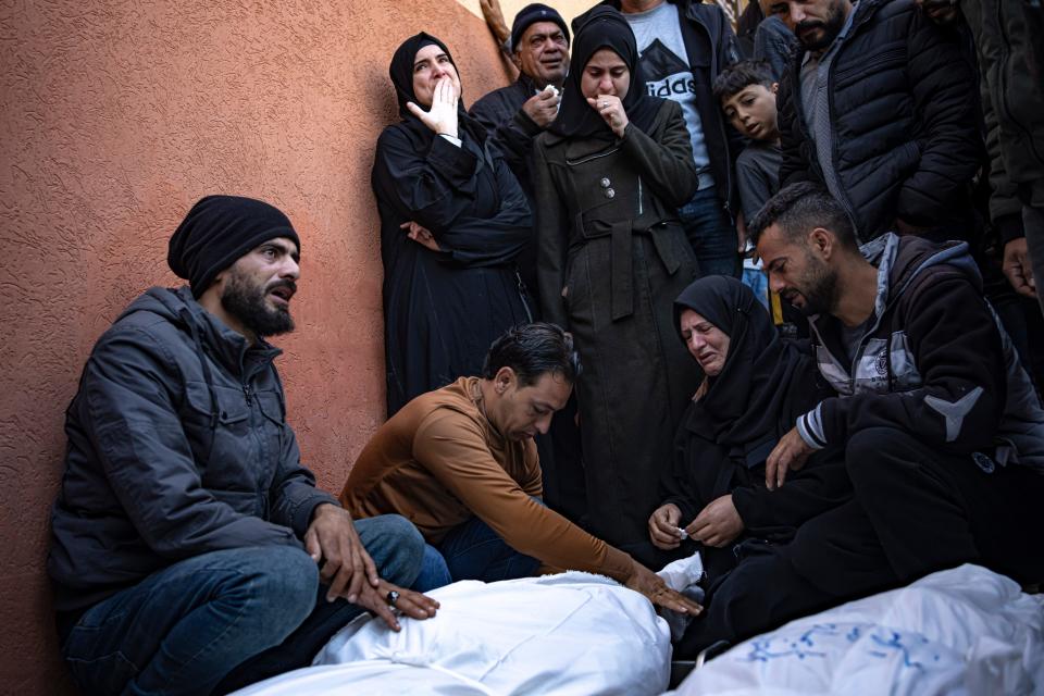 Palestinians mourn their relatives killed in the Israeli bombardment of the Gaza Strip, in the hospital in Khan Younis, Saturday, Dec. 2, 2023. (AP Photo/Fatima Shbair) ORG XMIT: XOB106