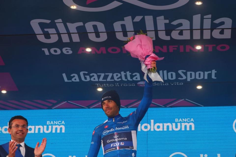 Groupama  FDJs French rider Thibaut Pinot celebrates his best climbers blue jersey on the podium after the nineteenth stage of the Giro dItalia 2023 cycling race 183 km between Longarone and Tre Cime di Lavaredo rifugio Auronzo on May 26 2023 Photo by Luca Bettini  AFP Photo by LUCA BETTINIAFP via Getty Images