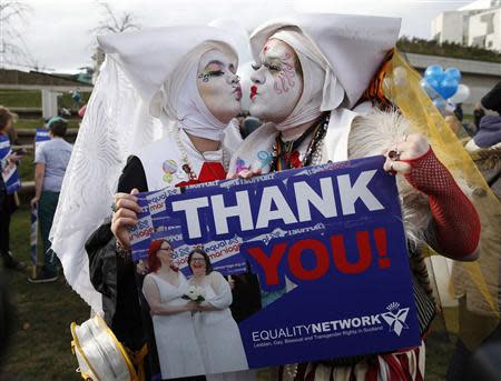 Supporters attend a symbolic same-sex marriage outside the Scottish Parliament in Edinburgh, Scotland February 4, 2014. REUTERS/Russell Cheyne