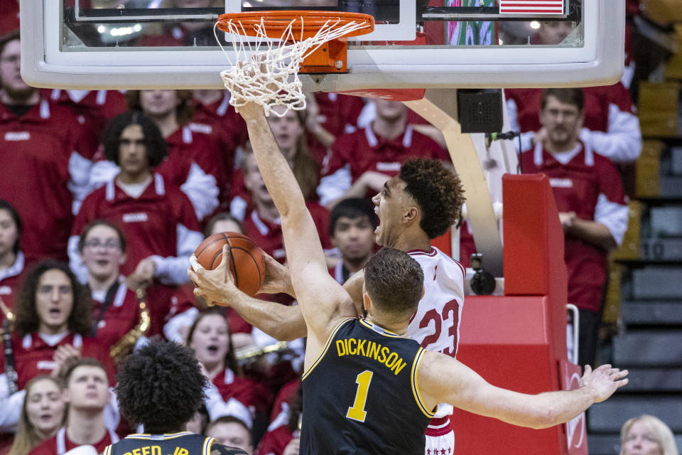Indiana forward Trayce Jackson-Davis (23) shoots from under the basket while defended by Michigan center Hunter Dickinson (1) during the first half of an NCAA college basketball game, Sunday, March 5, 2023, in Bloomington, Ind. (AP Photo/Doug McSchooler)