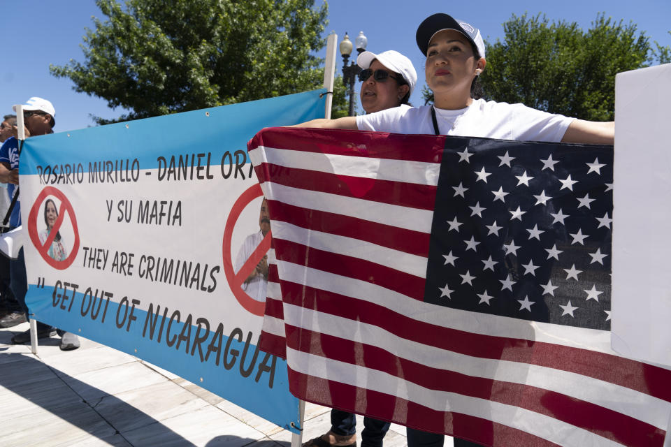 Nicaragua supporters protest outside of the Organization of the American States asking to free political prisioners and stop the government's human rights violations against critics, during a rally in Washington, Wednesday, June 23, 2021. (AP Photo/Jose Luis Magana)