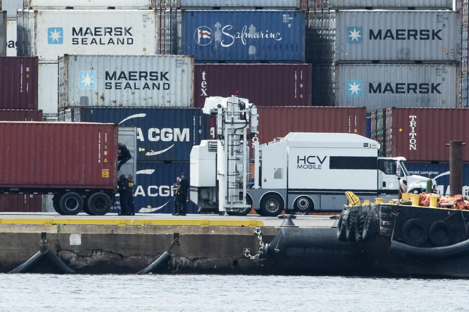 Authorities search a container along the Delaware River in Philadelphia, Tuesday, June 18, 2019. U.S. authorities have seized more than $1 billion worth of cocaine from a ship at a Philadelphia port, calling it one of the largest drug busts in American history. The U.S. attorney’s office in Philadelphia announced the massive bust on Twitter on Tuesday afternoon. Officials said agents seized about 16.5 tons (15 metric tons) of cocaine from a large ship at the Packer Marine Terminal. (AP Photo/Matt Rourke)