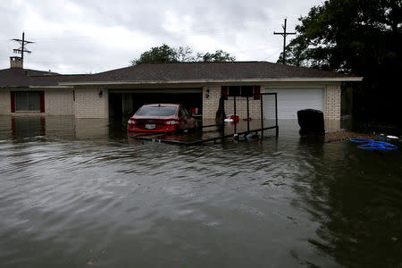 A house is seen submerged by flood waters from Tropical Storm Harvey in Orange, Texas, U.S., August 30, 2017. REUTERS/Jonathan Bachman