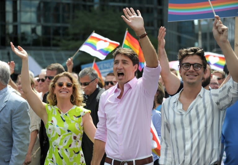 "It's great to celebrate today with everyone. Bonne fierte. Happy Pride," Justin Trudeau told the crowd, dressed in a pale pink shirt and white trousers