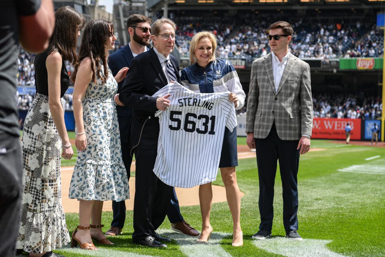 Apr 20, 2024; Bronx, New York, USA; Longtime Yankee announcer John Sterling is honored during a pregame ceremony in recognition of his retirement before a game against the Toronto Blue Jays at Yankee Stadium.