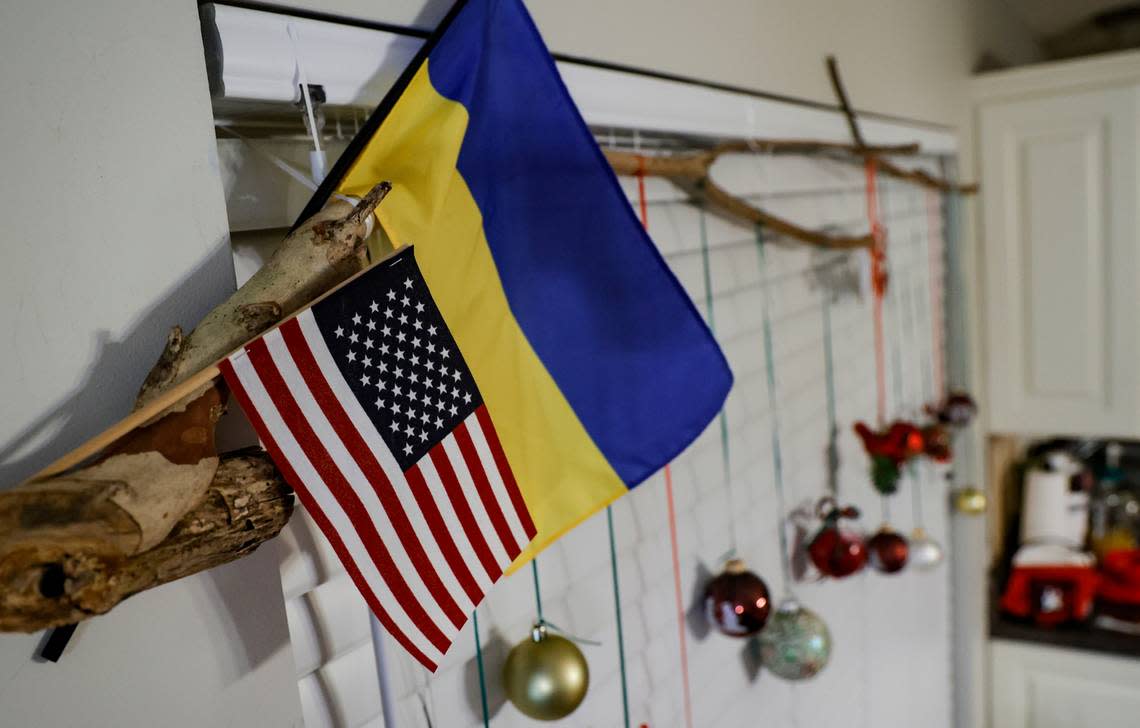 Holiday decorations and the flags of the United States and Ukraine hang in the home of the Mazur family in Chapin. The Mazurs fled Ukraine in mid August.