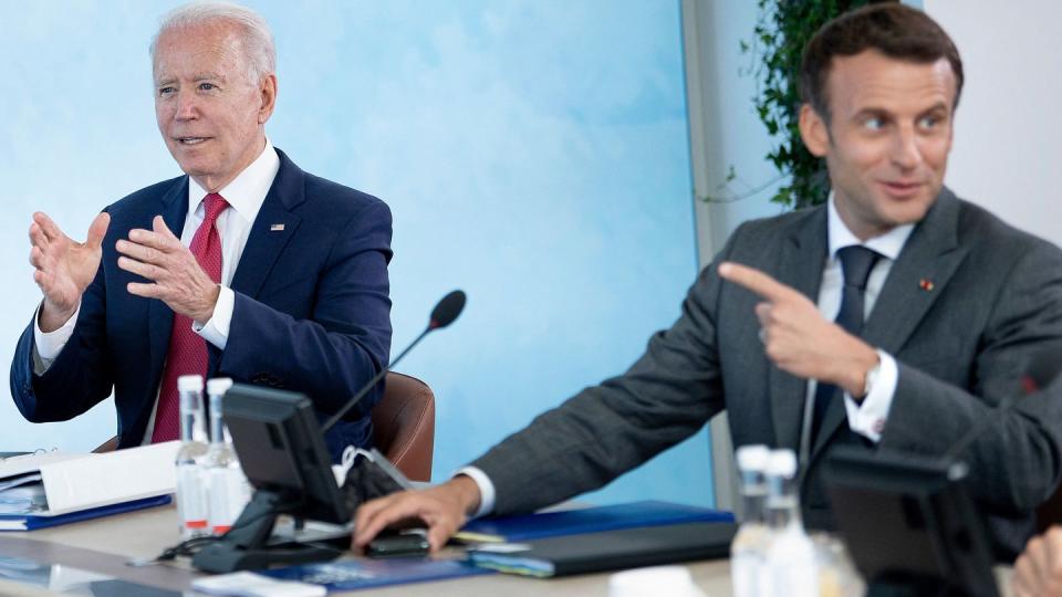U.S. President Joe Biden, left, is seen with French President Emmanuel Macron at a working session during the G7 summit in Carbis Bay, Cornwall, on June 12, 2021. (Brendan Smialowski/AFP via Getty Images)