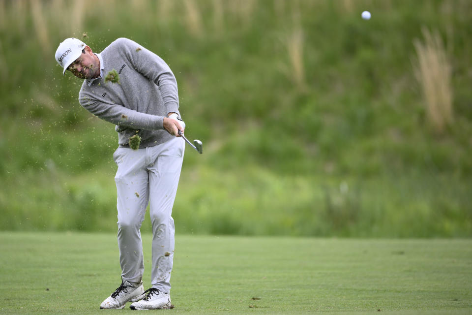 Keegan Bradley hits from the fairway on the 13th hole during the final round of the Wells Fargo Championship golf tournament, Sunday, May 8, 2022, at TPC Potomac at Avenel Farm golf club in Potomac, Md. (AP Photo/Nick Wass)