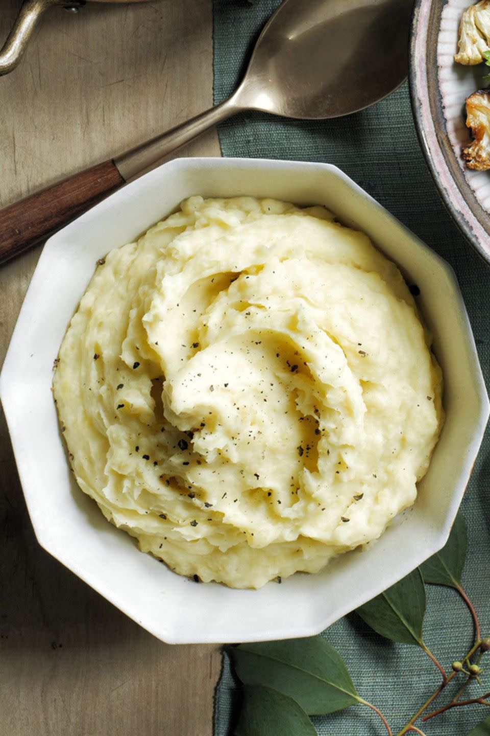 <p>Throw your potatoes in slow cooker and let the machine do all the work. </p><p><strong><em><a href="https://www.womansday.com/food-recipes/food-drinks/recipes/a60492/slow-cooker-mashed-potatoes-recipe/" rel="nofollow noopener" target="_blank" data-ylk="slk:Get the Slow Cooker Mashed Potatoes recipe;elm:context_link;itc:0;sec:content-canvas" class="link ">Get the Slow Cooker Mashed Potatoes recipe</a>.</em></strong></p>