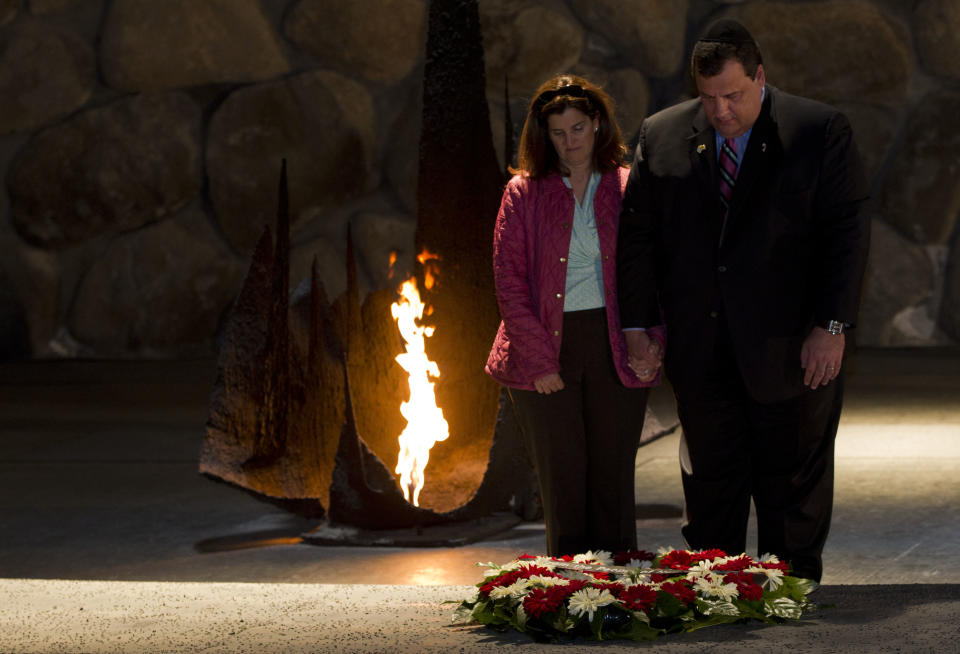 New Jersey Gov. Chris Christie and his wife Mary Pat pause after laying a wreath at the Hall of Remembrance at the Yad Vashem Holocaust memorial in Jerusalem, Tuesday, April 3, 2012. Christie kicked off his first official overseas trip Monday meeting Israel's leader in a visit that may boost the rising Republican star's foreign policy credentials ahead of November's presidential election. (AP Photo/Bernat Armangue)