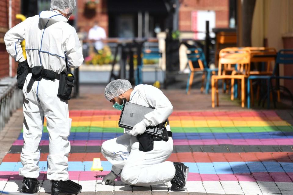 Police forensic officers in Hurst Walk in Birmingham after a number of people were stabbed (PA)