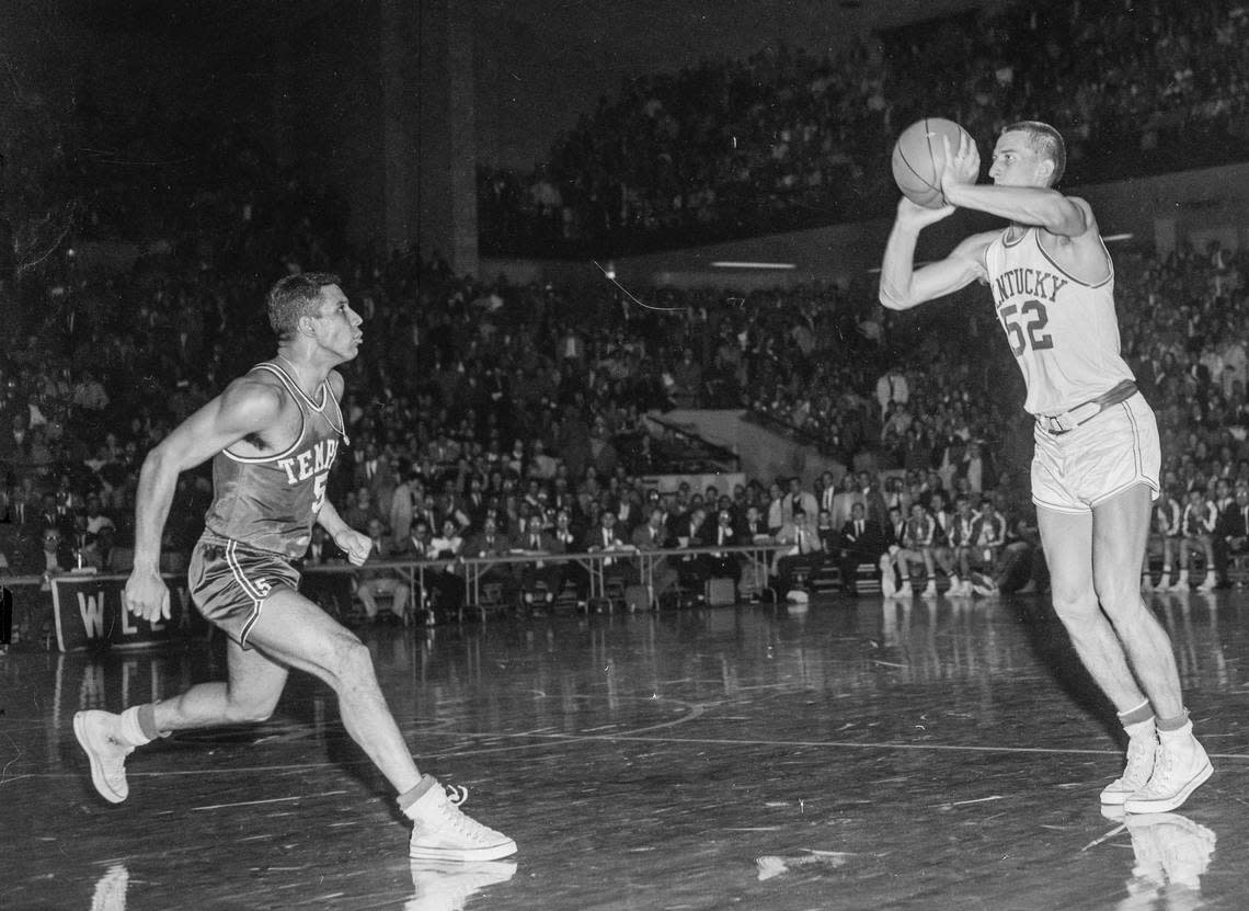 Kentucky’s Vernon Hatton puts up a 47-foot shot with one second left in the first overtime to tie Temple, 71-71. The Wildcats defeated the Owls in triple overtime, 85-83, in Memorial Coliseum on Dec. 7, 1957.