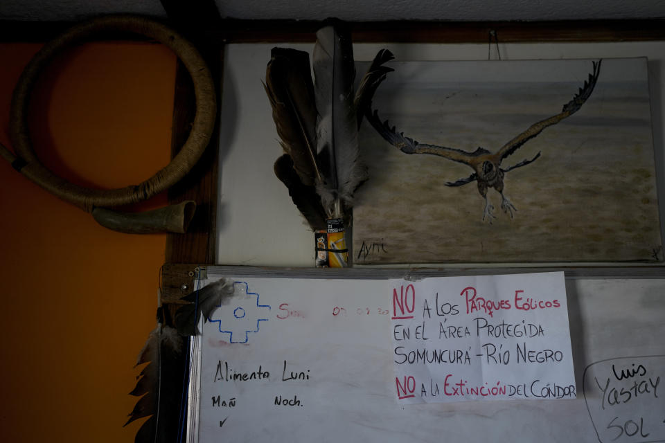 A sign in Spanish reads "No to wind farms in the Somuncura protected area, Rio Negro. No to the extinction of the condor" at the base of the Andean Condor Conservation Program that for 30 years has hatched chicks in captivity, rehabilitated others and freed them across South America, in the Sierra Paileman in the Rio Negro province of Argentina, Wednesday, Oct. 12, 2022. Plans for a massive wind farm are putting at risk efforts to repopulate the Atlantic coast of Patagonia with the majestic bird. (AP Photo/Natacha Pisarenko)