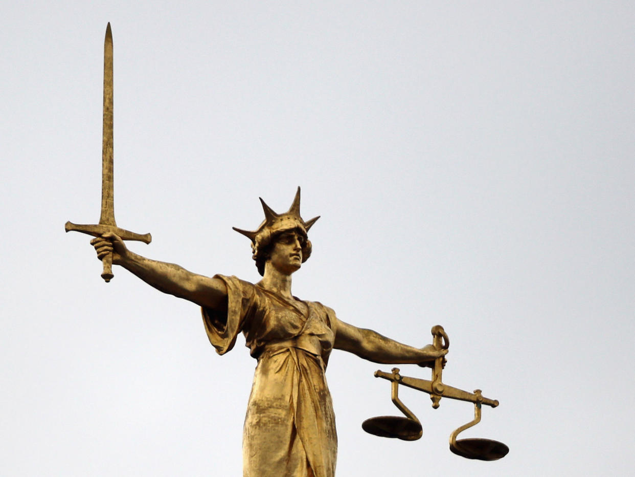 A statue of the scales of justice stands above the Old Bailey: Dan Kitwood/Getty Images