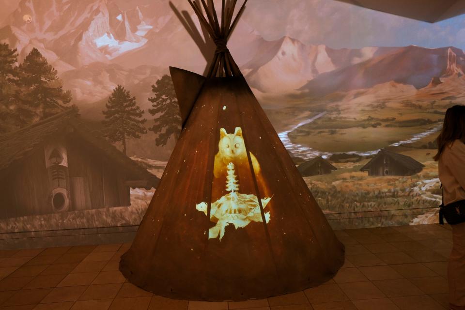 Images are projected onto a replica teepee inside the National Cowboy & Western Heritage Museum's new "Find Your West" immersive exhibition during the exhibit's grand opening Monday, April 29, 2024, at the museum in Oklahoma City. The first-of-its-kind, projection-mapped exhibit is part of the museum's $40 million "Live the Code" capital campaign.