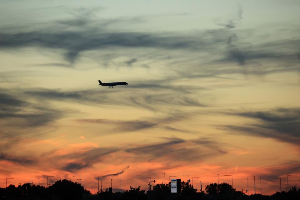 A passenger aircraft prepares to land at Munich International Airport in Munich, Germany, on Saturday, June 25, 2022.  Photographer: Krisztian Bocsi/Bloomberg