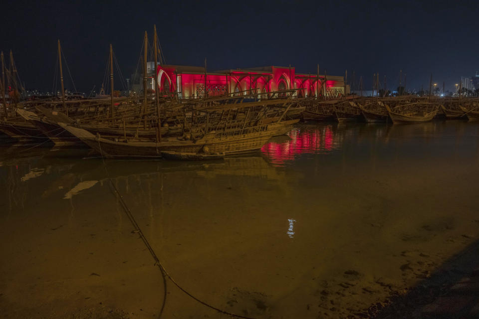 Traditional wooden boats are docked on the corniche in Doha, Qatar, Friday, Oct. 14, 2022. (AP Photo/Nariman El-Mofty)